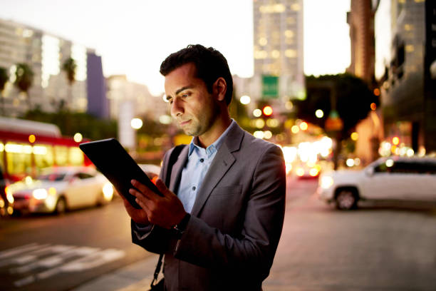 istock Digital tablet at night in the city. 675680988