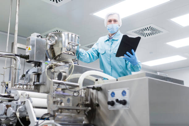 istock scientist check readings of machine 675684264