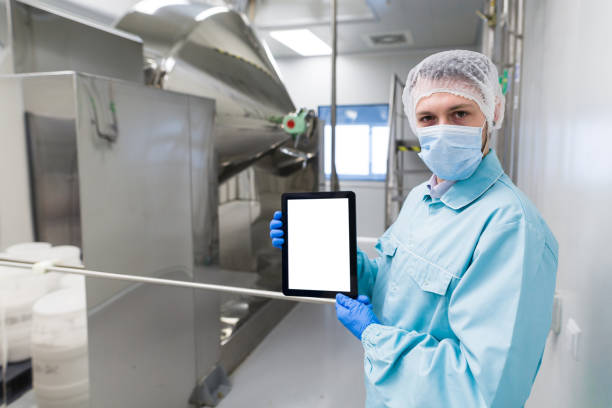 istock scientist show empty tablet near steel machine 675684408