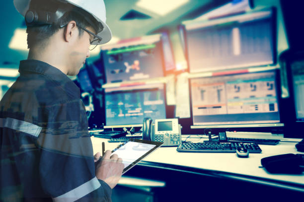 istock Double exposure of  Engineer or Technician man in working shirt  working with tablet in control room of oil and gas platform or plant industrial for monitor process, business and industry concept 675684754