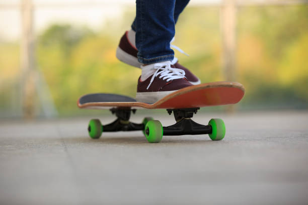 istock skateboarder legs skateboarding at skatepark 675684834