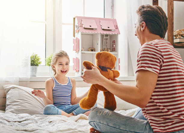 istock father and daughter play 675687850