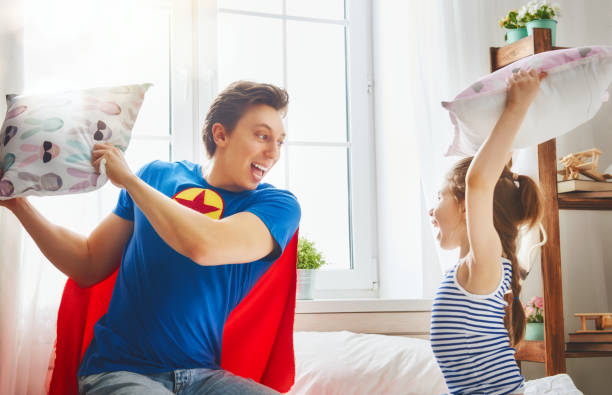 istock father and daughter play 675688054