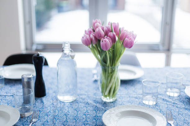 istock Bouquet of pink tulips on a served table 675688494