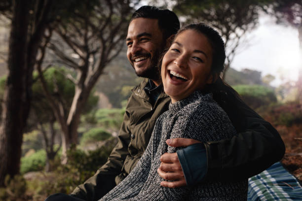 istock hiker couple resting after hike 675688858