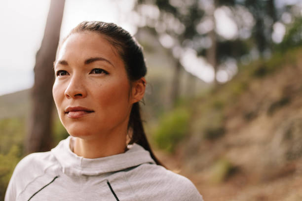 istock Young woman runner looking away 675691930