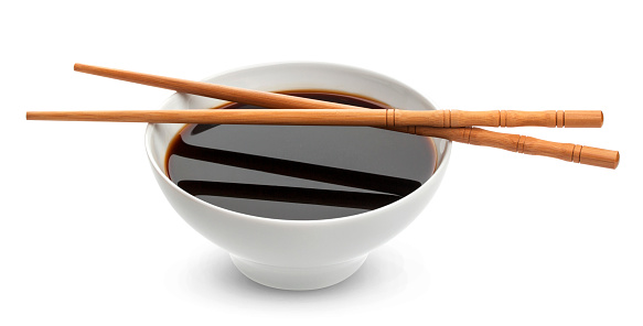 Soy sauce and chopsticks isolated on white background, with clipping path