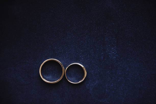 istock Wedding rings on a blue suede background. Wedding details. 675695350