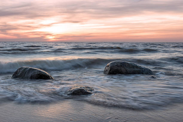 istock Sea landscape. Sea and stones at sunset. 675701432