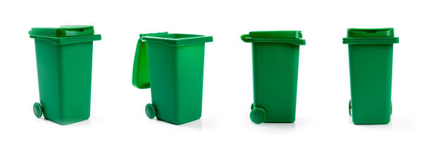 green wheelie waste bin isolated on white background