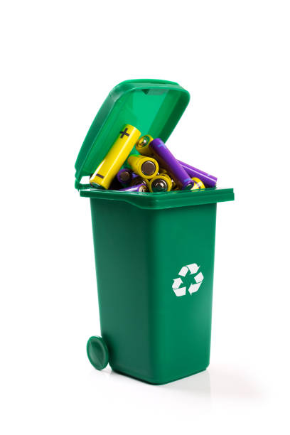 istock hazardous waste recycling - green wheelie bin full with batteries 675704076