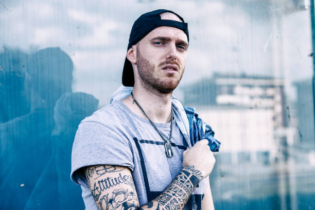 istock a rap singer is reflected in a blue mirror on the outskirts 675704160