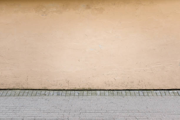 istock Urban background. Old street wall and pavement 675705508