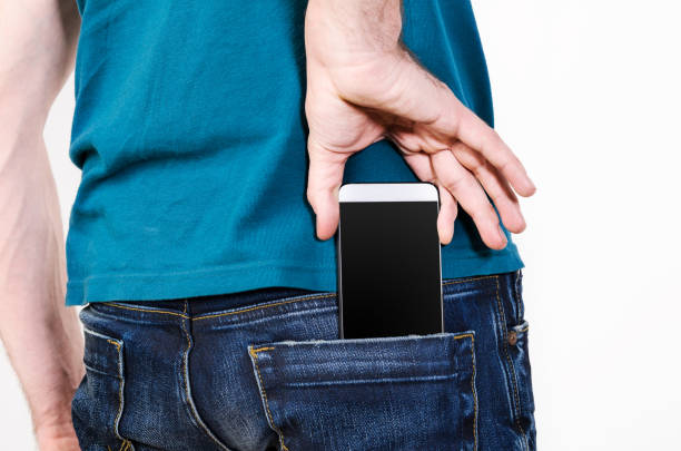 Mobile phone in a pocket stock photo