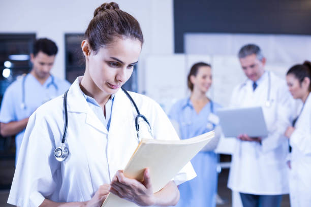 istock Female doctor checking a medical report 675711482