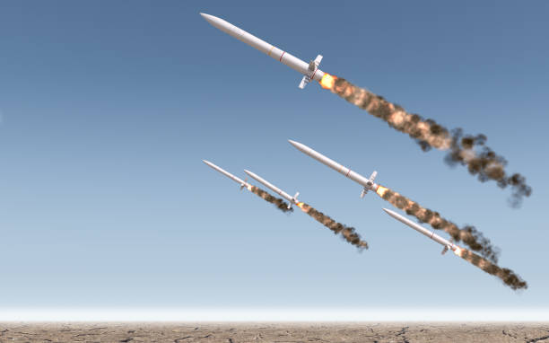 Intercontinental Ballistic Missile A row of intercontinental ballistic missiles launching in a desert on a blue sky backgrund - 3D render air attack stock pictures, royalty-free photos & images