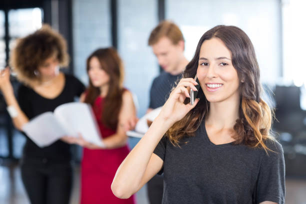 istock Businesswoman talking on mobile phone 675712156