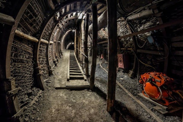 istock Hard coal mine underground corridor with steel support system and electrical equipment 675715664