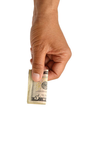 Dropping Five Dollar Bill stock photo