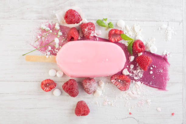 istock raspberries with ice cream in pink chocolate 675715952