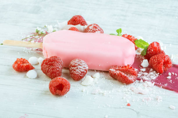 istock raspberries with ice cream in pink chocolate 675715960