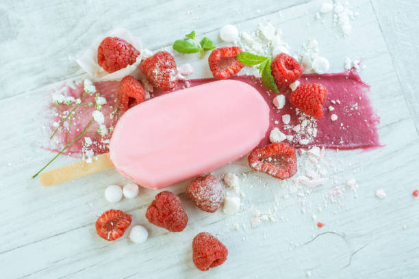 istock raspberries with ice cream in pink chocolate 675715966