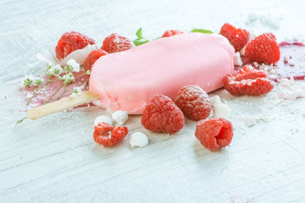 istock raspberries with ice cream in pink chocolate 675715980