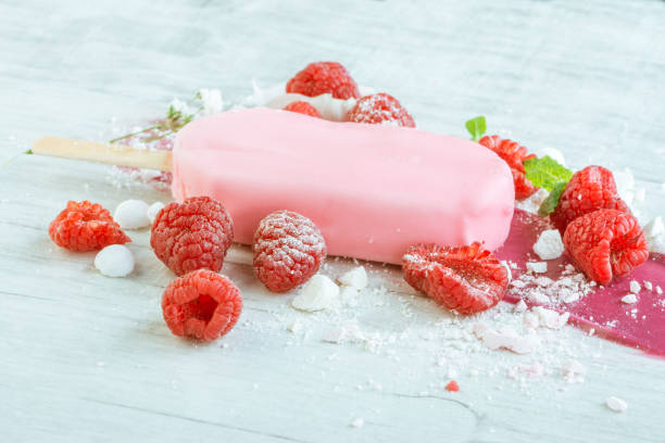 istock raspberries with ice cream in pink chocolate 675715994