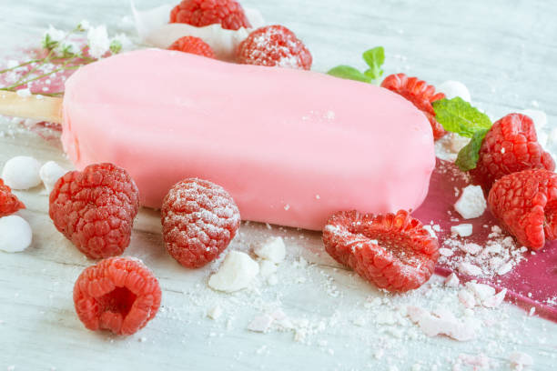 istock raspberries with ice cream in pink chocolate 675716014