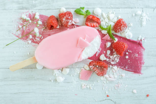 istock raspberries with ice cream in pink chocolate 675716046