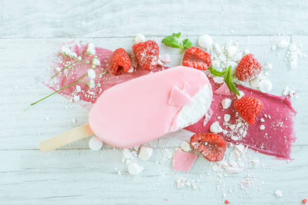 istock raspberries with ice cream in pink chocolate 675716176
