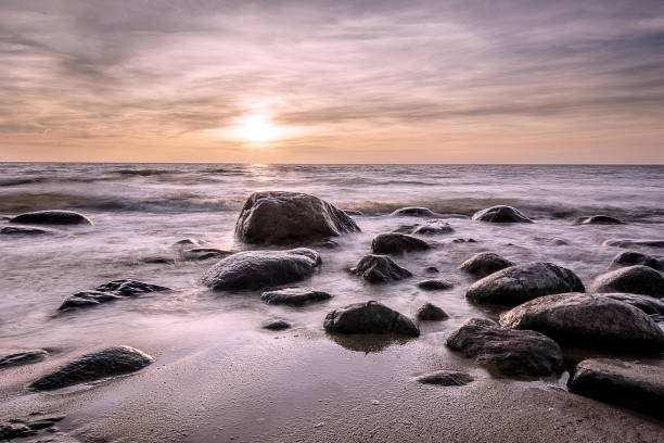 istock Sea landscape. Golden hour at stony beach. 675716264