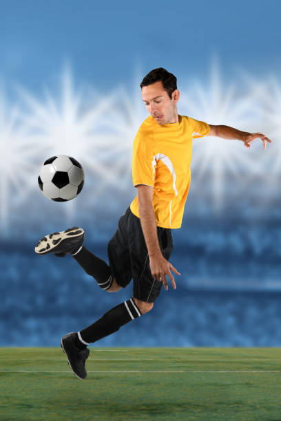 istock Soccer Player Back Kicking Ball 675716648
