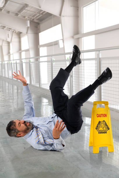 istock Businessman Falling on Wet Floor 675722140