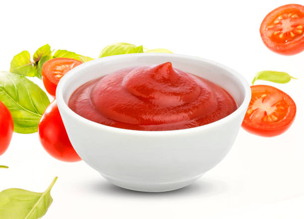 istock Ketchup in bowl on white background 675723104