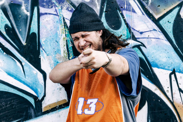 istock three rap singers in a subway with graffiti in the background 675723146