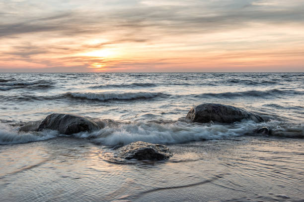 istock Sea landscape. Sea and stones at sunset. 675726866