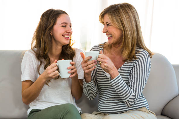 istock Mother and daughter drink tea 675730710