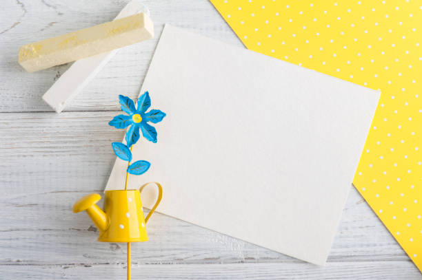 istock Yellow polka dot desk, note and watering can 675730848