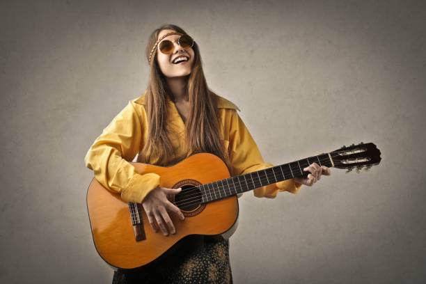 Hippie woman Hippie woman is playing guitar singer back stock pictures, royalty-free photos & images