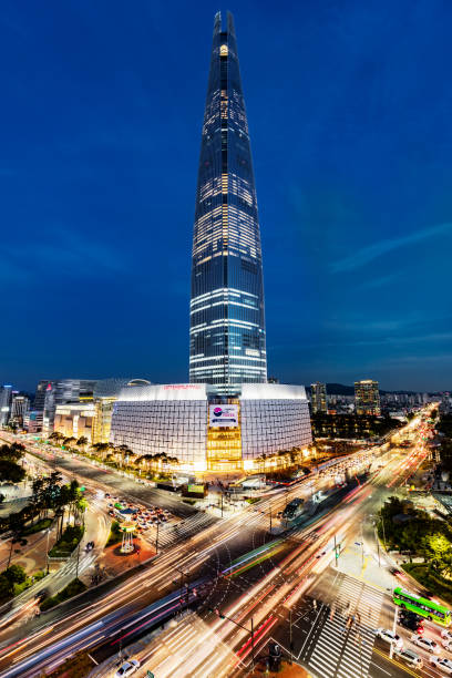 Cityscape Songpagu Skyscrapers Lotte World Tower at Night Seoul Cityscape of Songpagu district in Seoul at night. Motion blurred traffic lights, illuminated skyscrapers and Lotte world tower. Seoul, South Korea, Asia. Aerial view wide angle 42 MP Sony A7RII. kangnamgu stock pictures, royalty-free photos & images