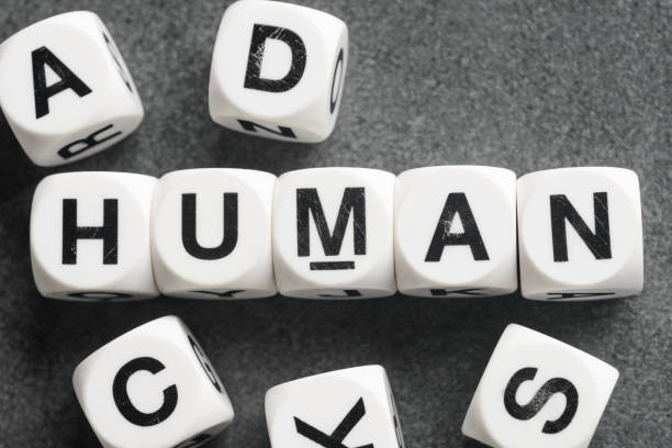 istock word human on toy cubes 675737594