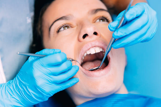istock Dentists with a patient during a dental intervention. 675737774