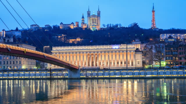Footbridge, courthouse and basilica by night, Lyon, France.