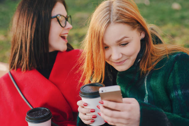 istock Two girls with gadget 675750358