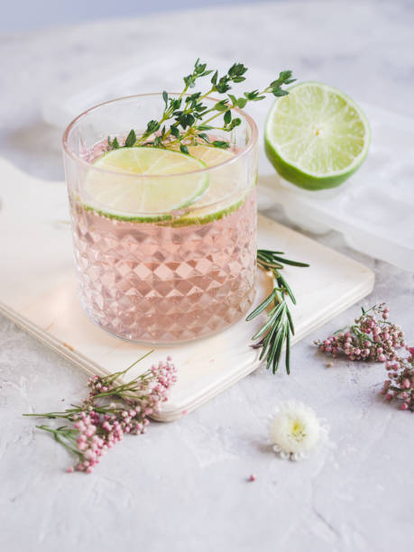 istock summer homemade juice with lime and blossom on stone table background 675752078