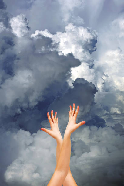 istock Two female hands on a background of clouds 675764554