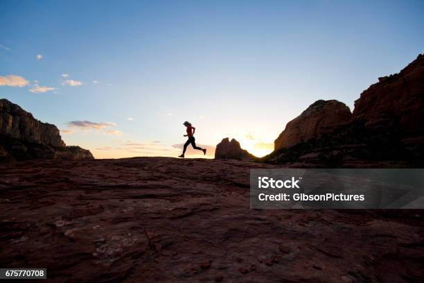 A Woman Goes For A Crosscountry Trail Run At Sunset In Sedona Arizona Usa Stock Photo - Download Image Now