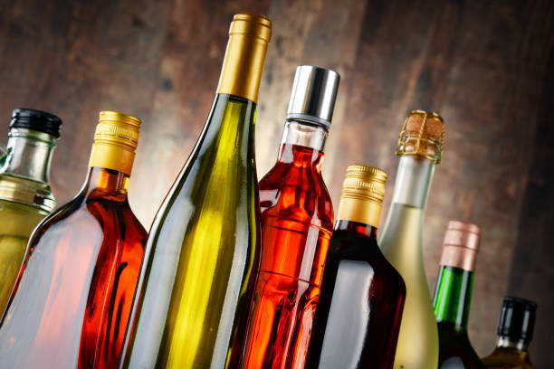 bottles of assorted alcoholic beverages - hard liquor imagens e fotografias de stock