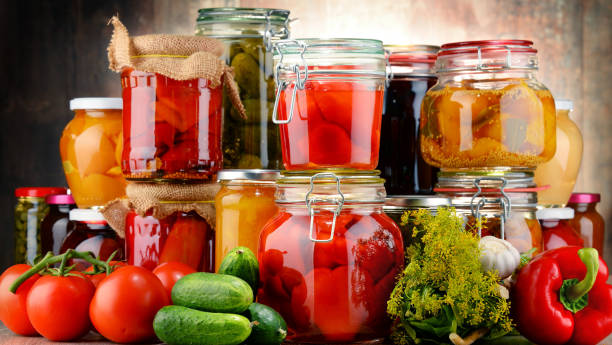 istock Jars with pickled vegetables and fruity compotes 675777242